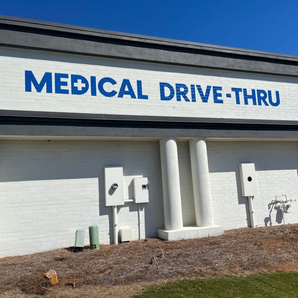Roswell Building Sign Brick Wrap Graphics