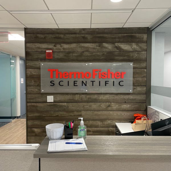 Waltham Thermo Fisher Scientific CorEvitas dimensional Reception Desk logo