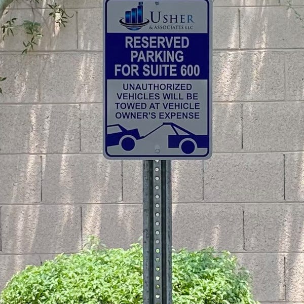Usher and Associates reserved parking sign created and installed by Arcadia Signarama call us at 602.954.4680 or online at http://www.ArcadiaSignarama.com