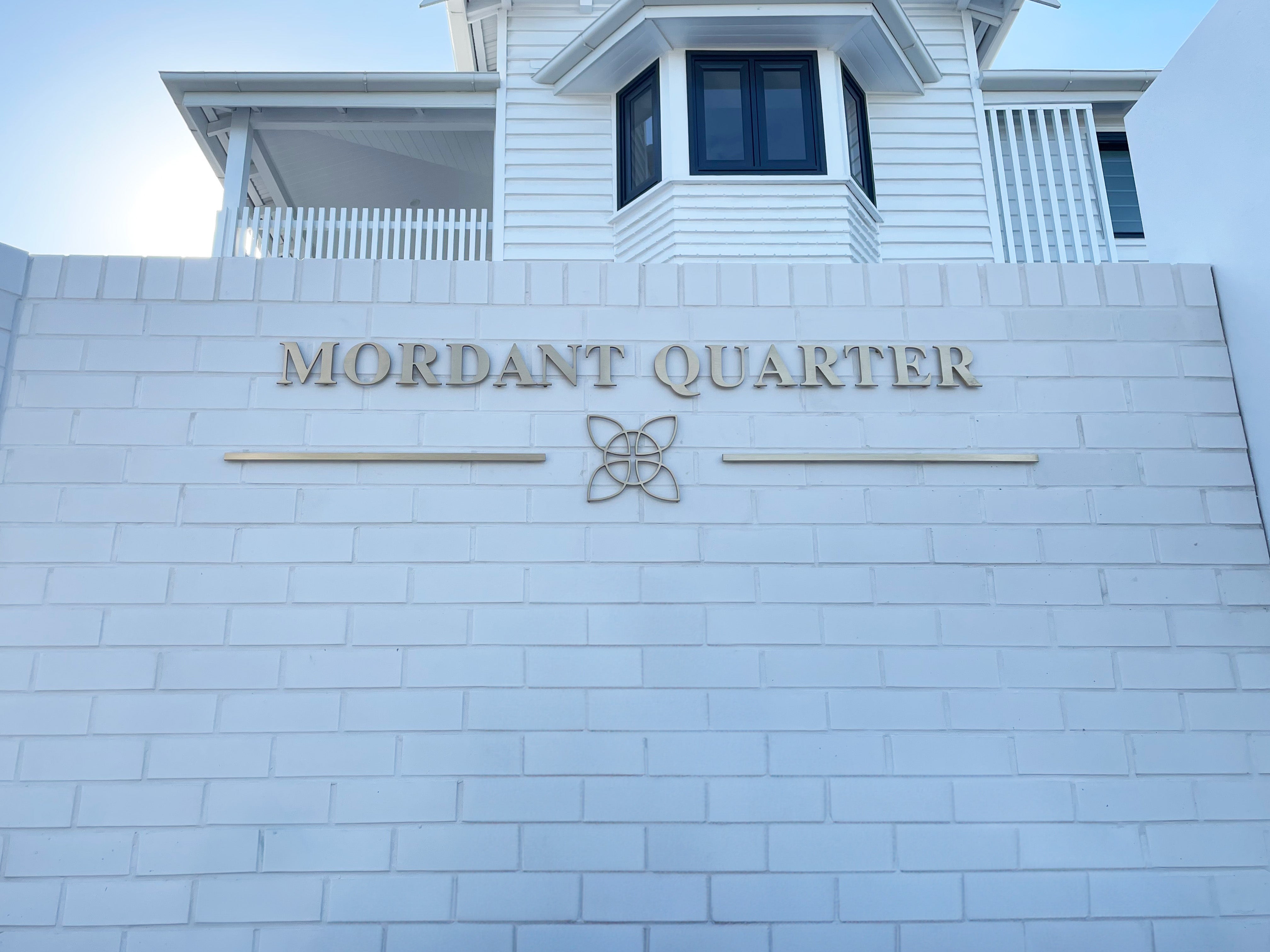 Mordant Quarter's Elegant Transformation with Brass Gold Letter Signage