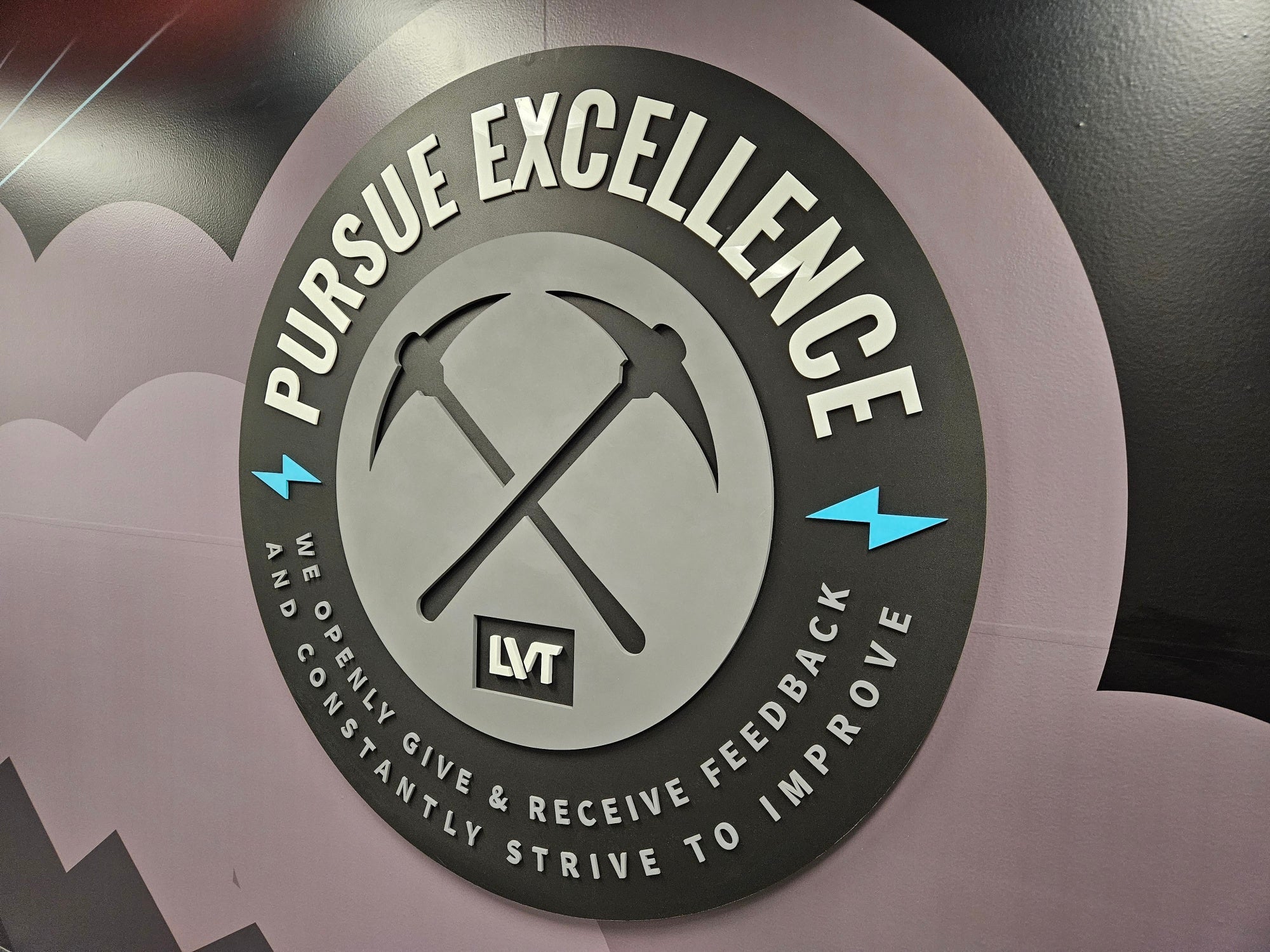 Interior Halo Illuminated Channel Letters • Dimensional Logo Medallion • Large Wall Murals in American Fork for LVT (a Security Systems Company).