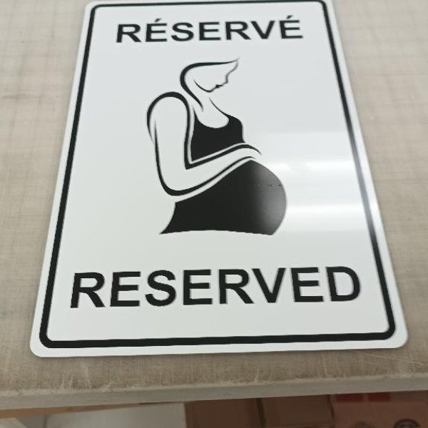 Interesting reserved parking sign