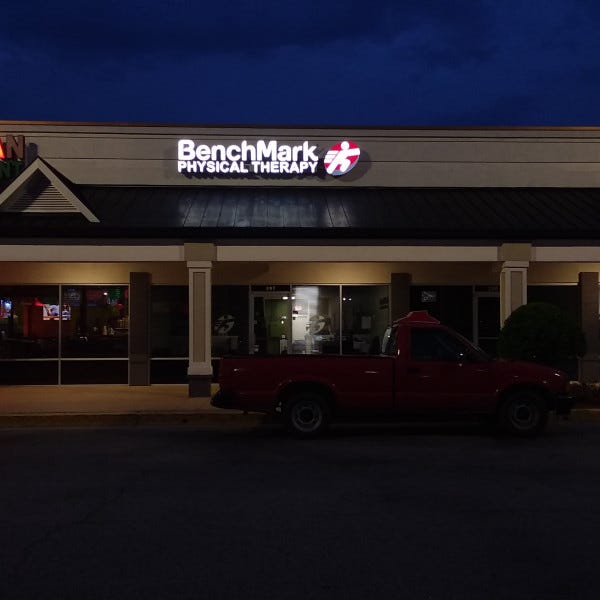 BenchMark Building Sign