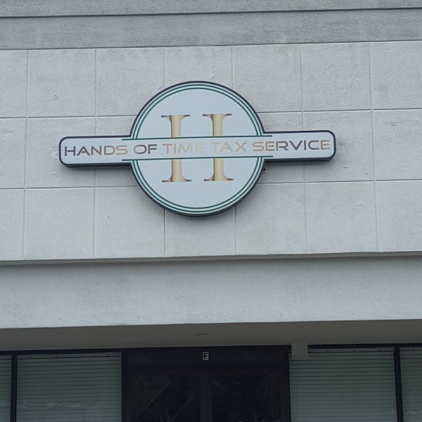 Hands Of Times Building Sign