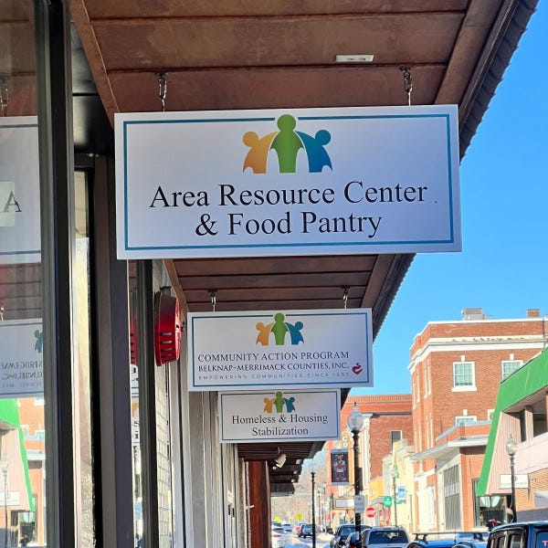 Community Action exterior hanging signs