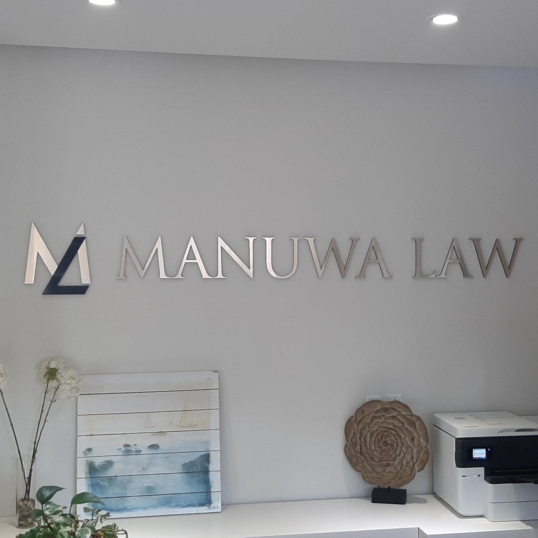 Reception Sign for Manuwa Law in Edmonton, AB