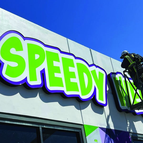 Speedy Weedy Building Sign