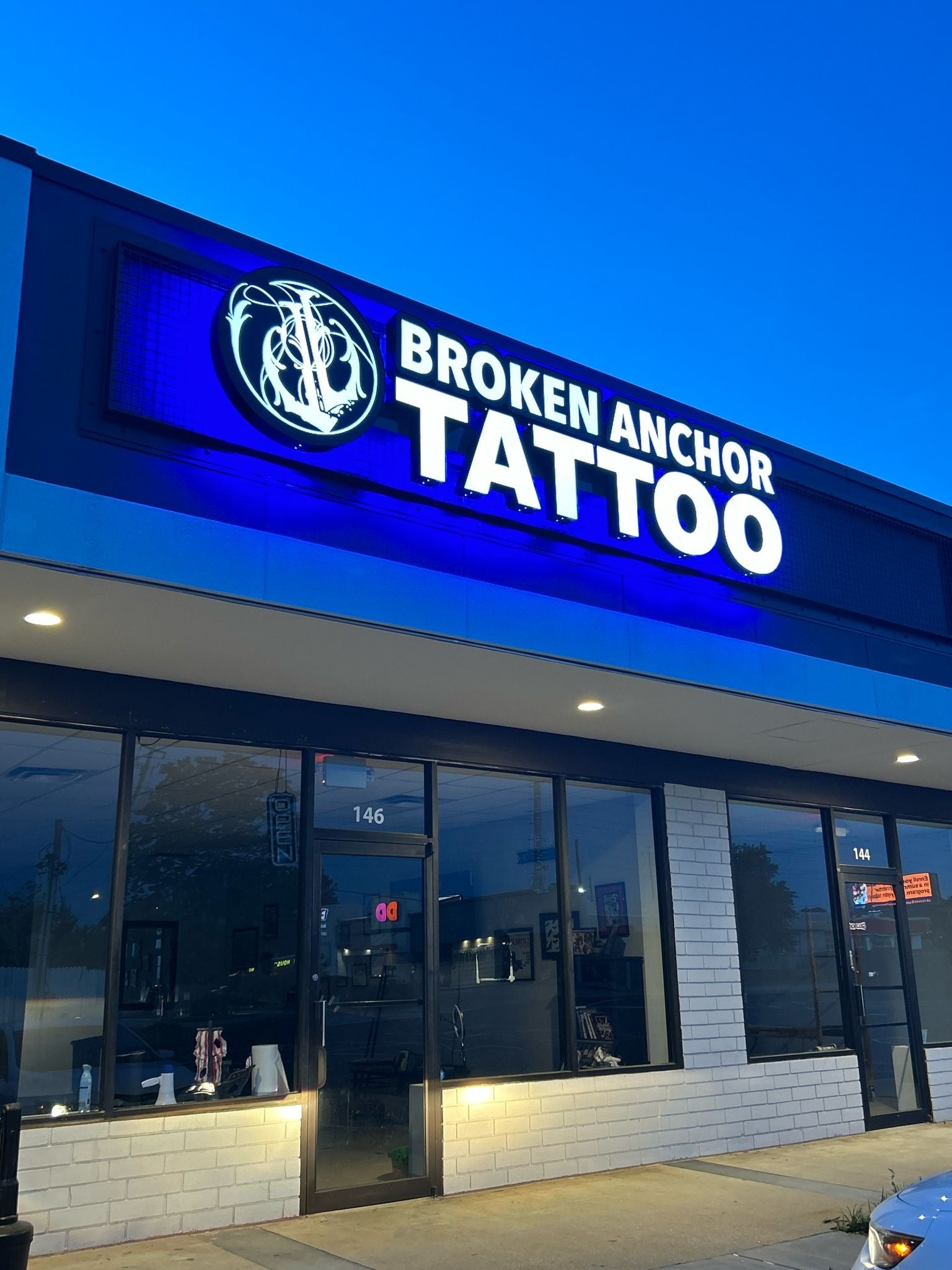 Light Box Logo and Front Lit Channel Letters With Broken Anchor Tattoo