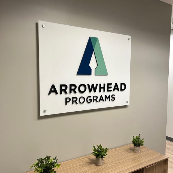 Acrylic lobby wall sign with dimensional logo and lettering for Arrowhead Programs