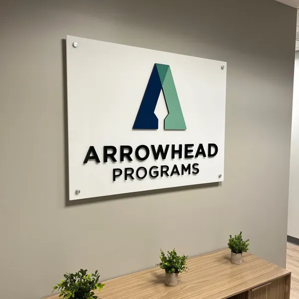 Acrylic lobby wall sign with dimensional logo and lettering for Arrowhead Programs