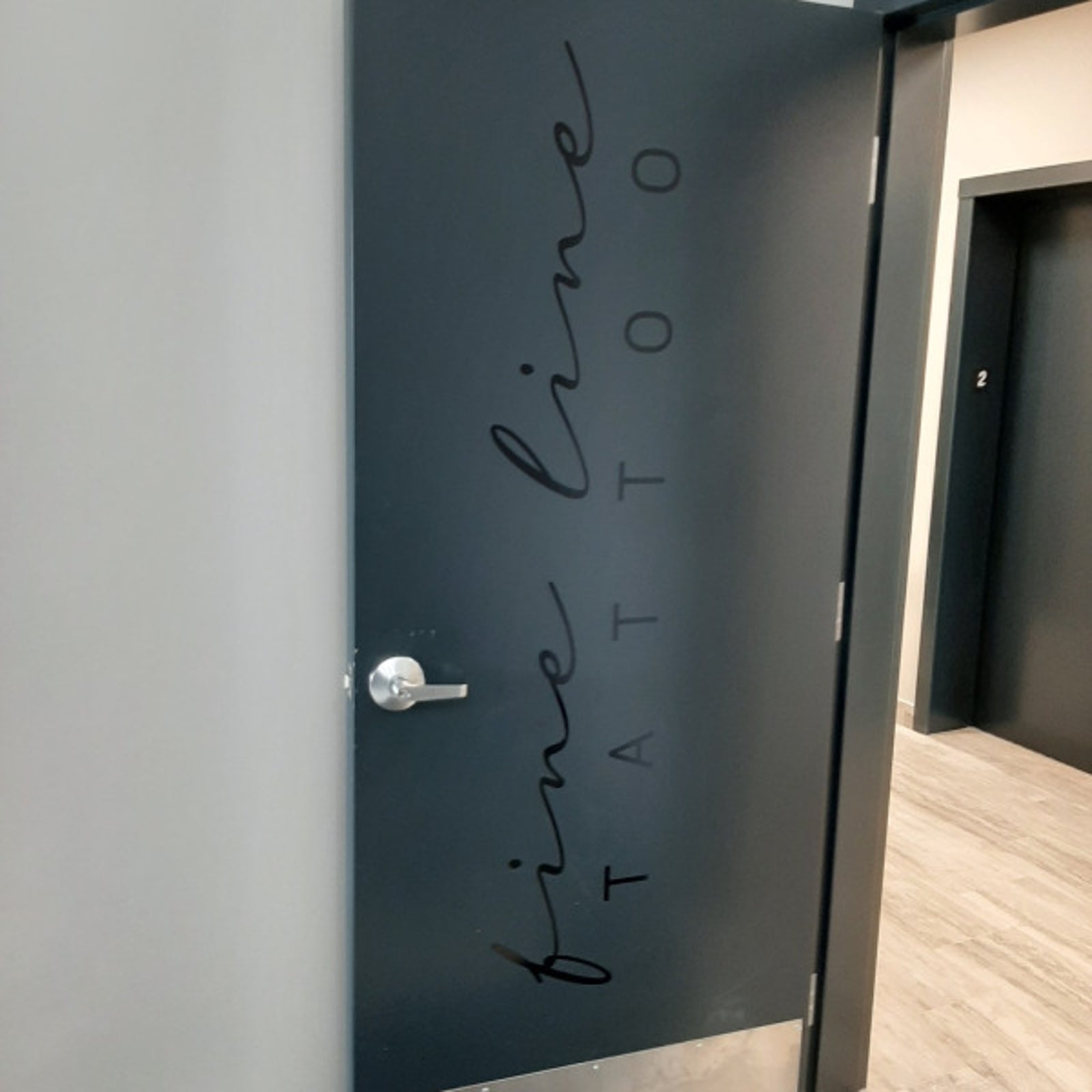 Subtle Door Graphics for Fine Line Tattoo in Edmonton, AB