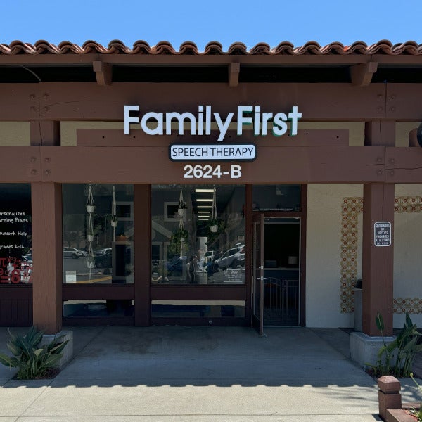 Lit mall storefront signage in Carlsbad