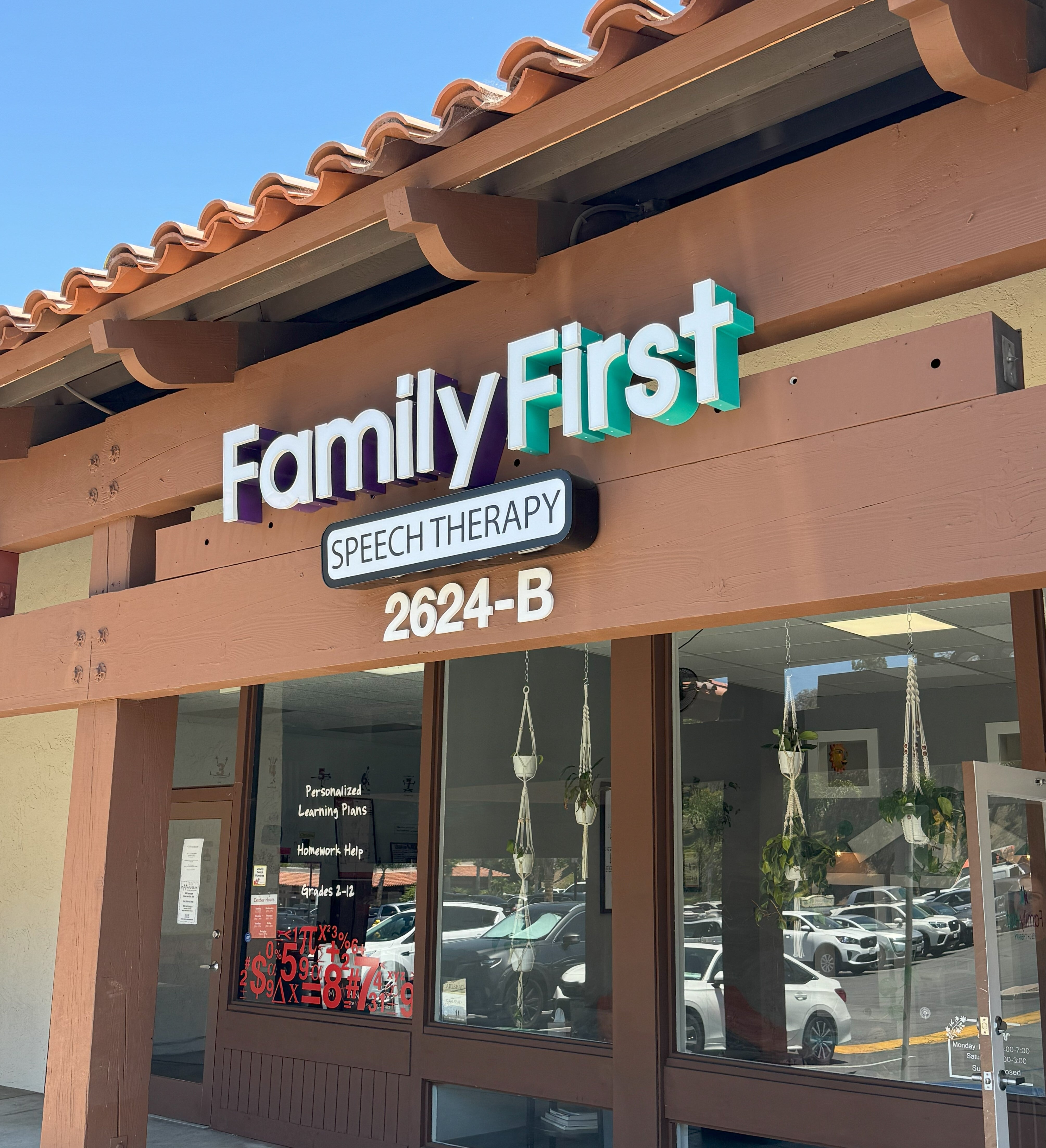 Lit mall storefront signage in Carlsbad