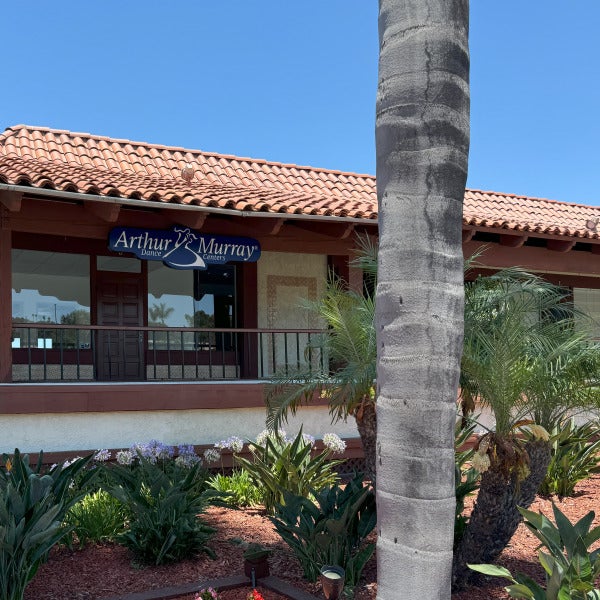 Lit mall storefront signage in Carlsbad