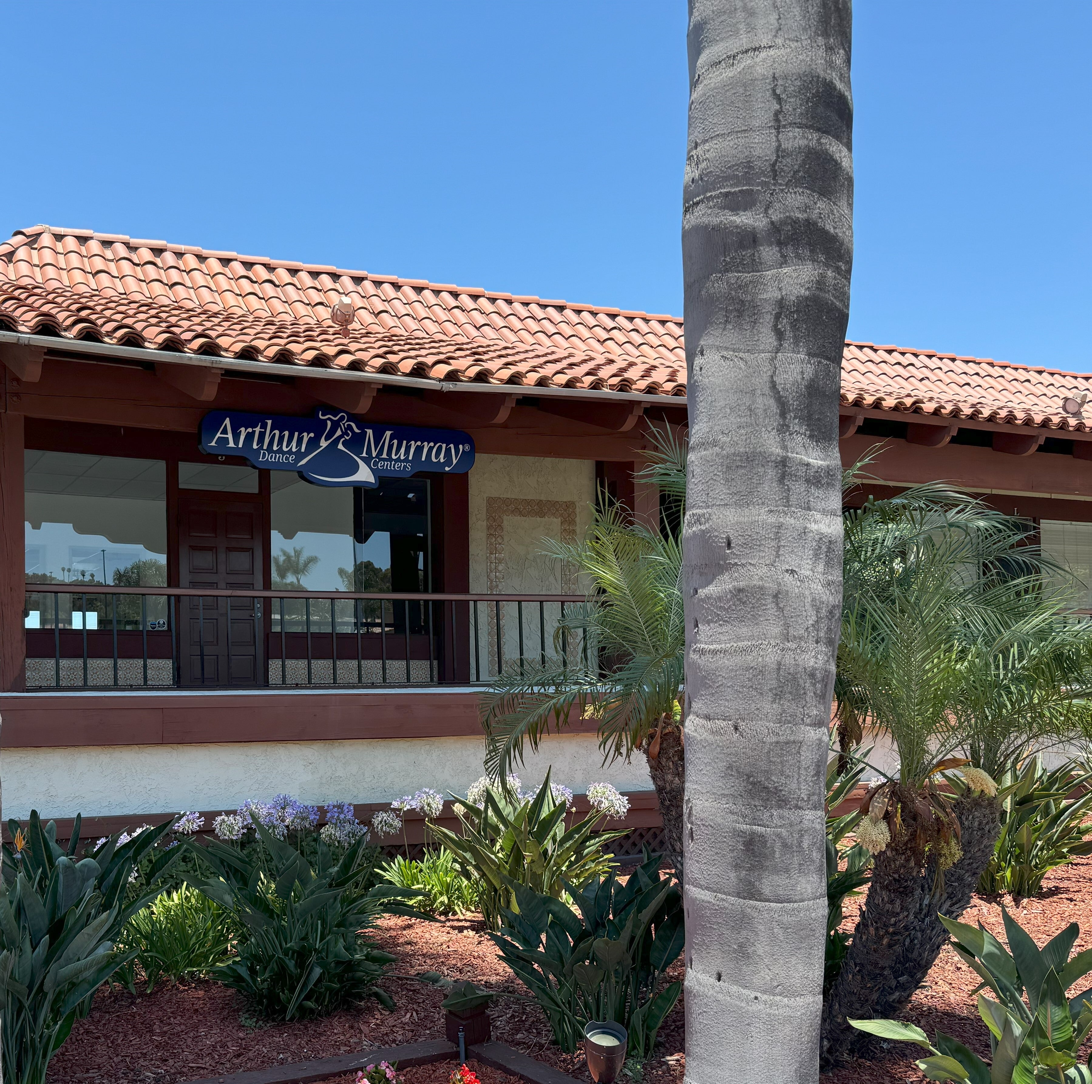 Lit mall storefront signage in Carlsbad