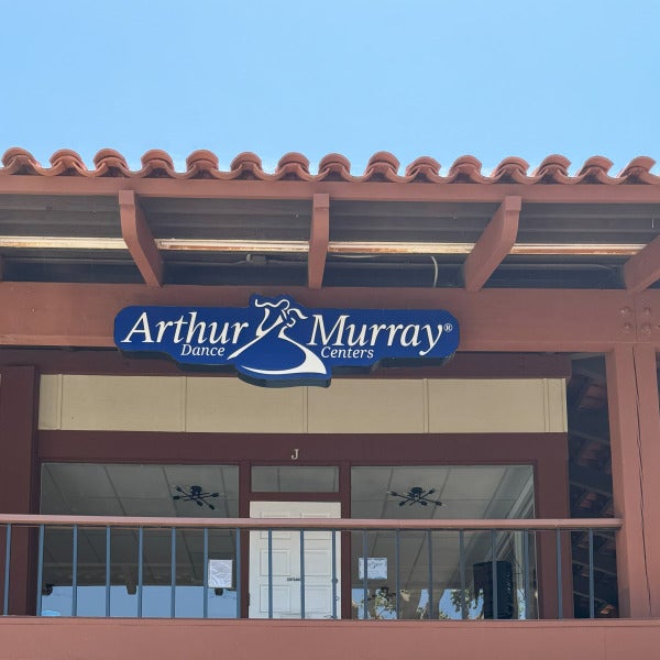 Lit mall storefront signage in Carlsbad