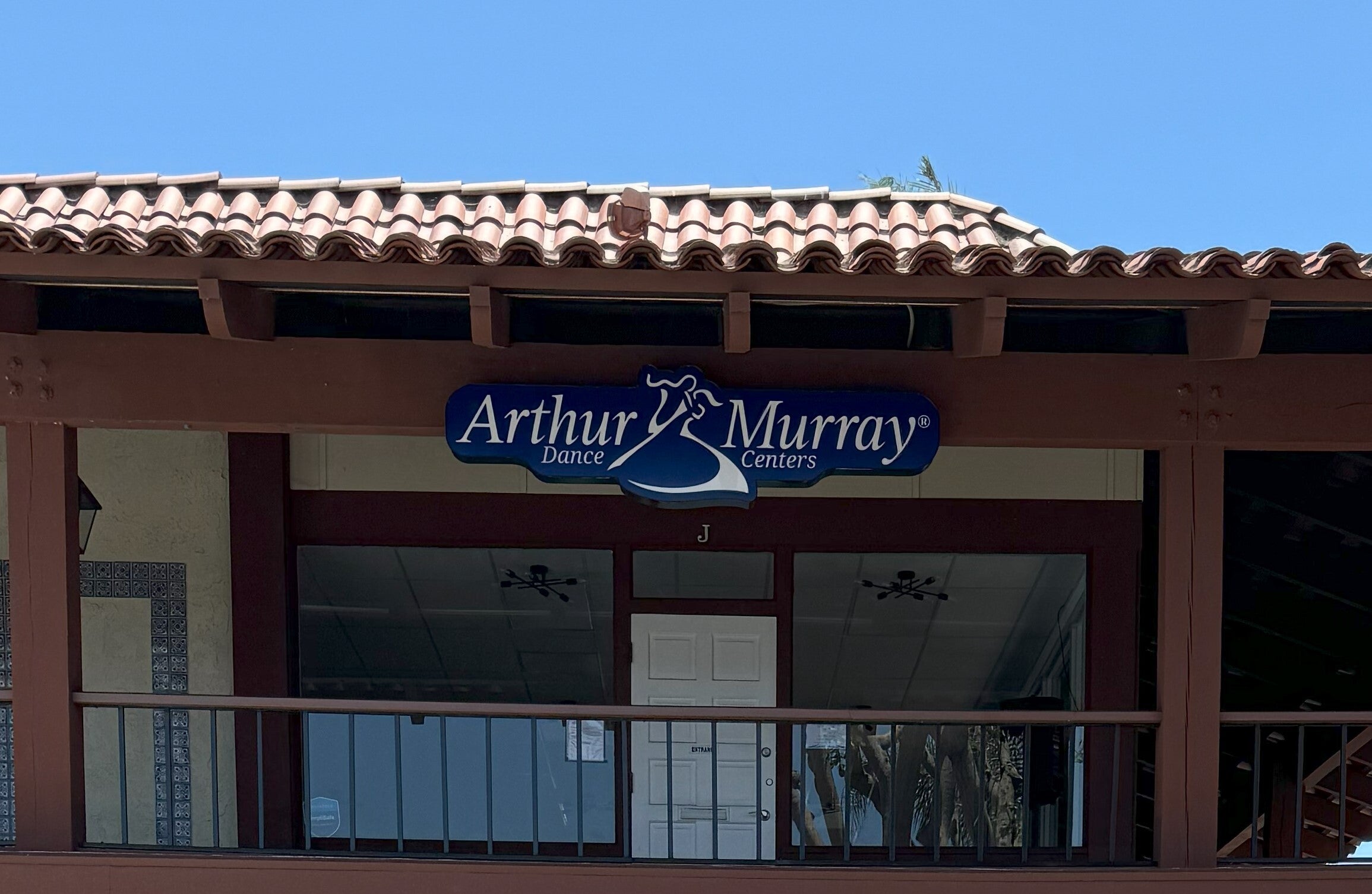 Lit mall storefront signage in Carlsbad