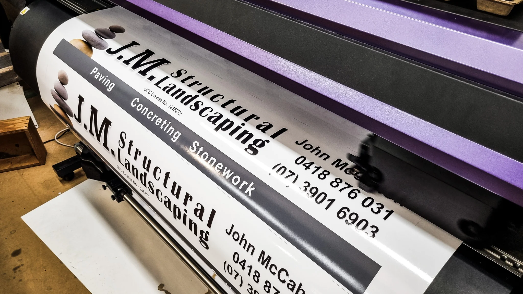 Printing of JM Structural Landscaping graphic on vinyl