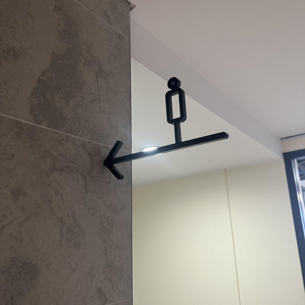 Black 3D Male Amenity Toilet Sign hung counterweight from wall