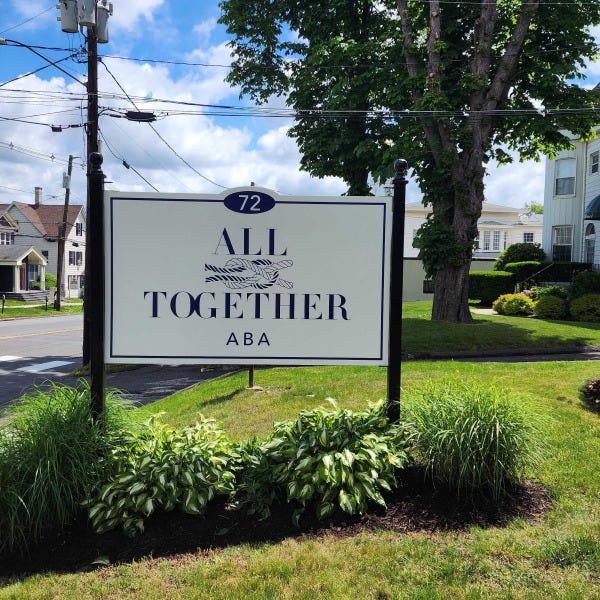 All Together Tower signs