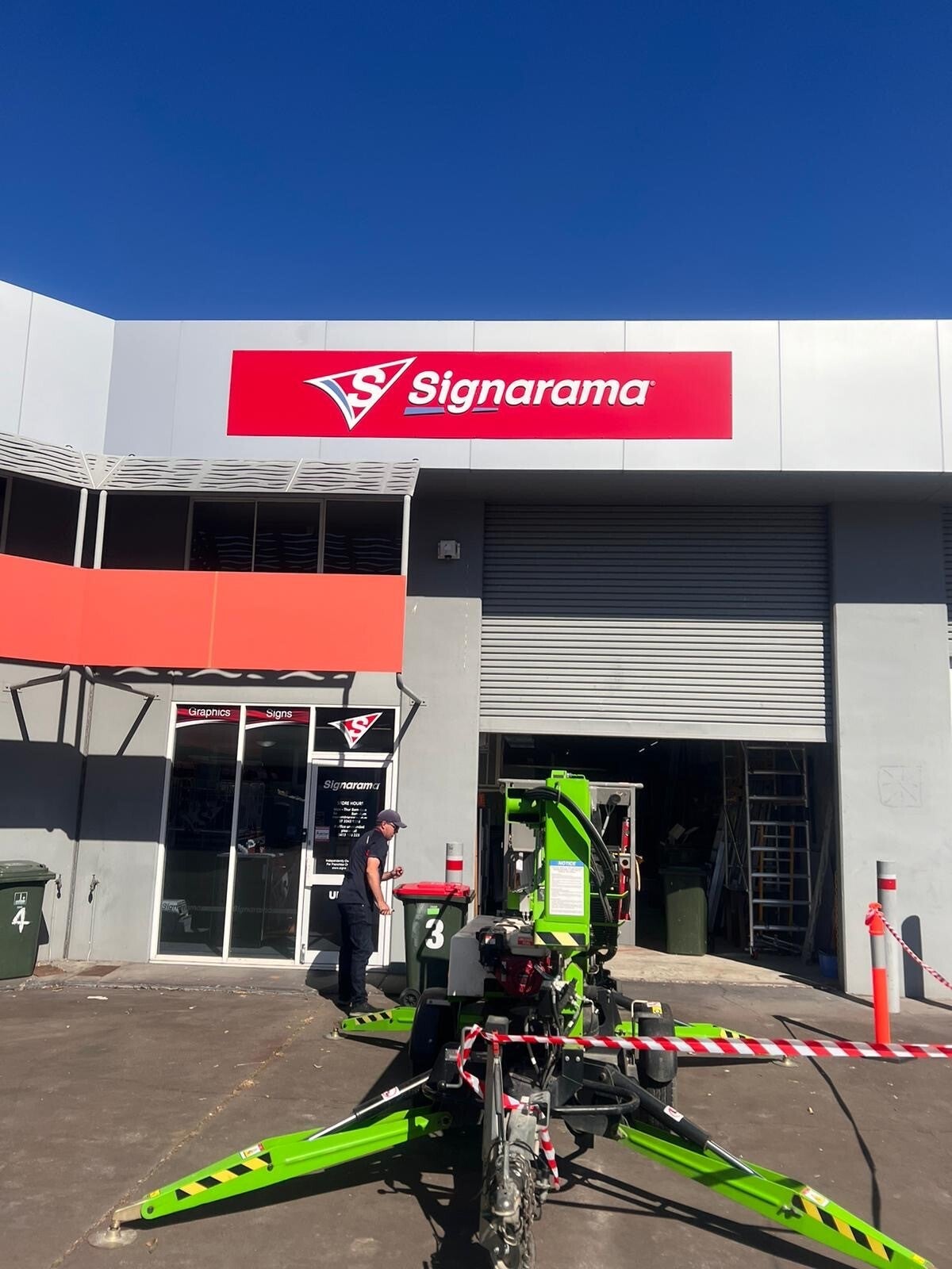 Installing our new signs!