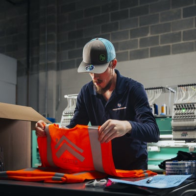 https://cdn.gorilladash.com/images/media/13617749/fully-promoted-usa-ca-0524-corporate-safetywear-apparelprinting-staged-9952-square-66b6572470dab.jpg?auto=webp&crop=1%3A1%2Csmart&width=400