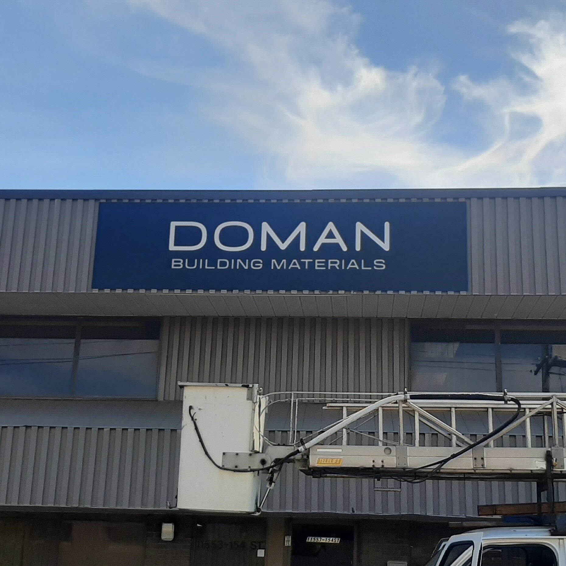 Black ACP Sign for Doman Building Materials in Edmonton, AB