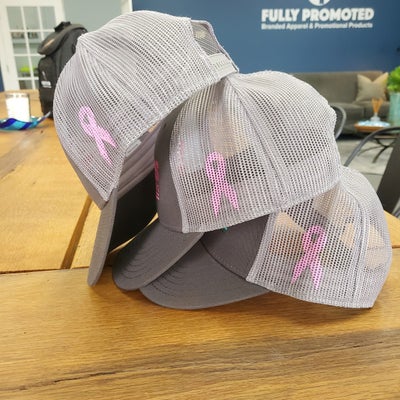 https://cdn.gorilladash.com/images/media/13812065/fully-promoted-usa-pink-ribbon-screen-print-hats-fp-centerville-square-66c5f0ede080a.jpg?auto=webp&crop=1%3A1%2Csmart&width=400