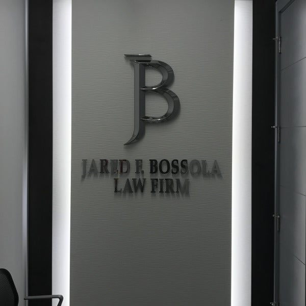 Jared Bossola Law Lit Lobby Sign