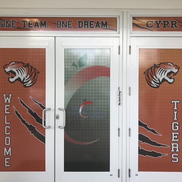 Renaissance Charter Cypress Perforated Door Graphics