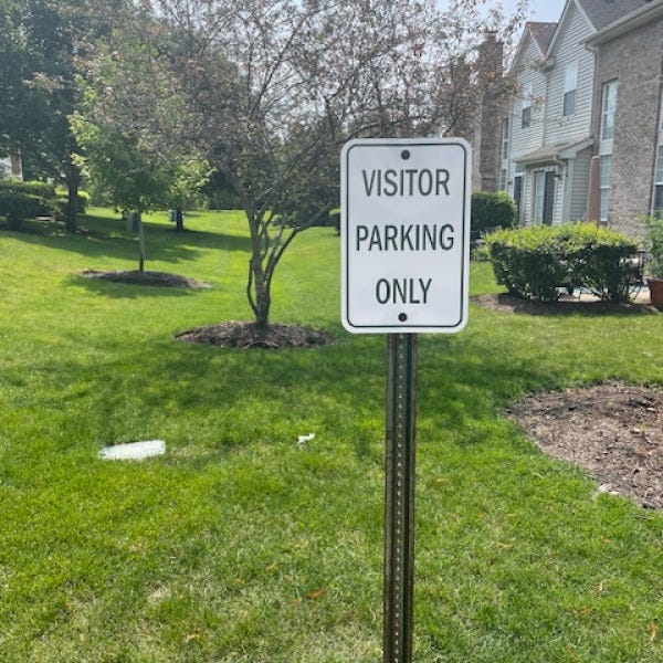Associates-Visitor-Parking-sign