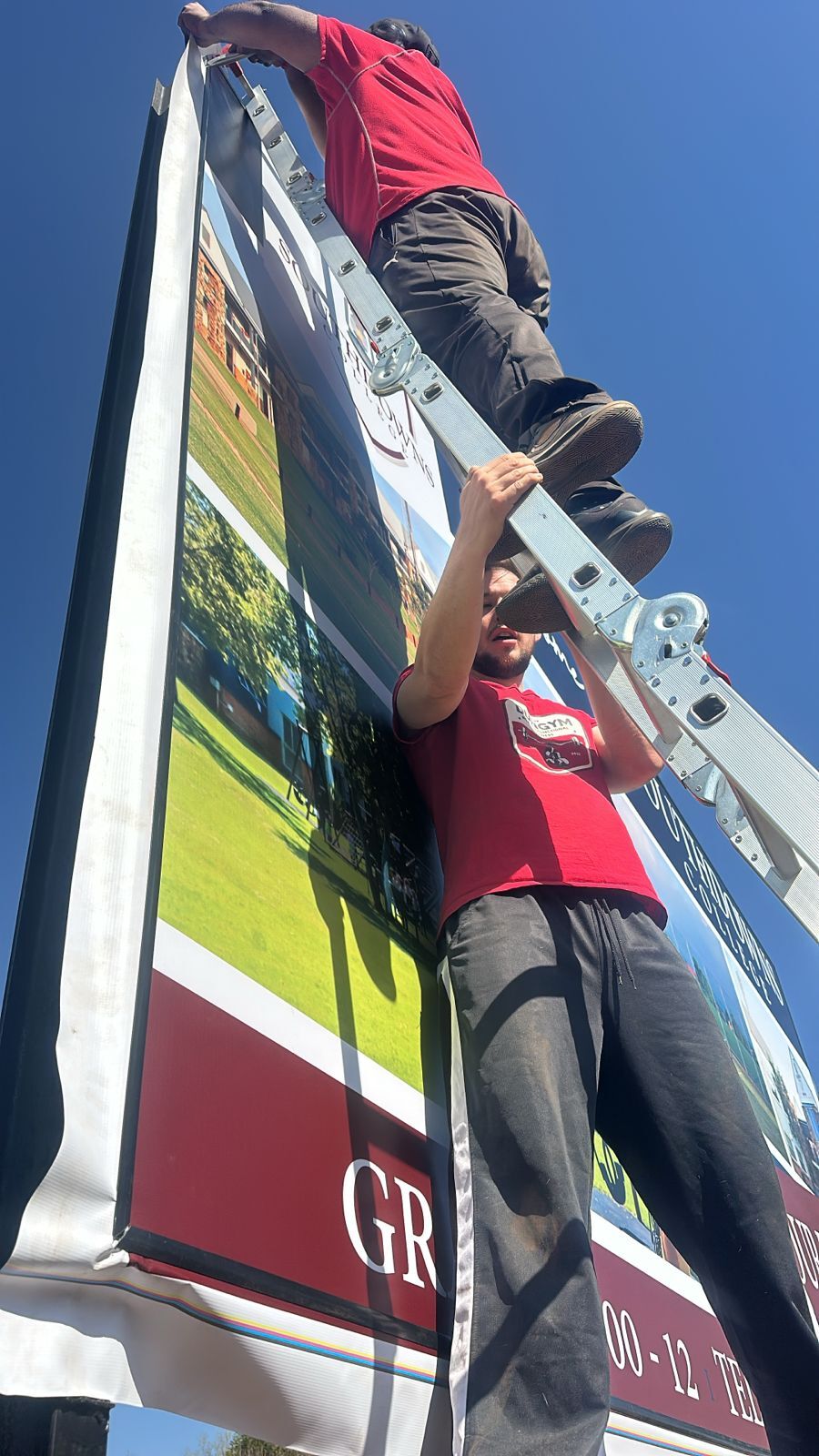 All hands on deck to help with this stunning signage