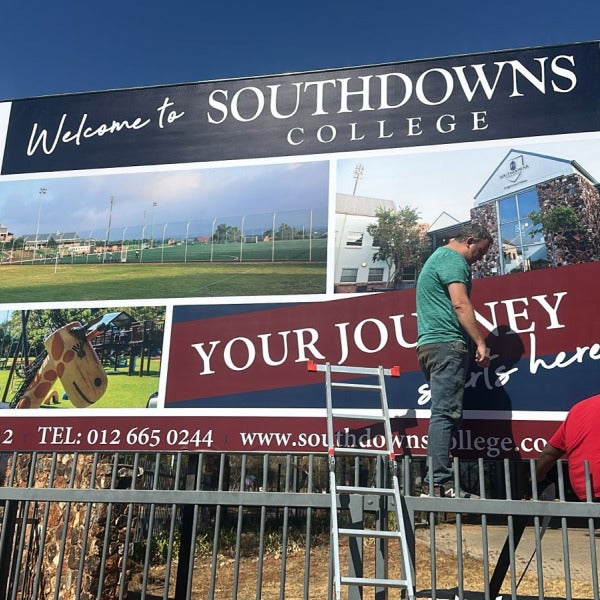 All hands on deck to help with this stunning signage
