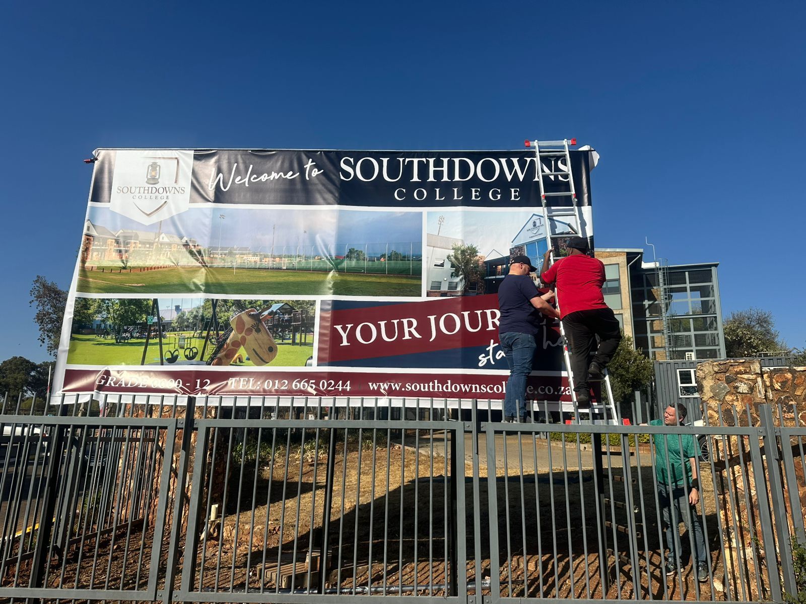 All hands on deck to help with this stunning signage