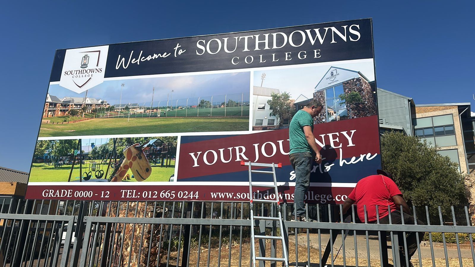 All hands on deck to help with this stunning signage