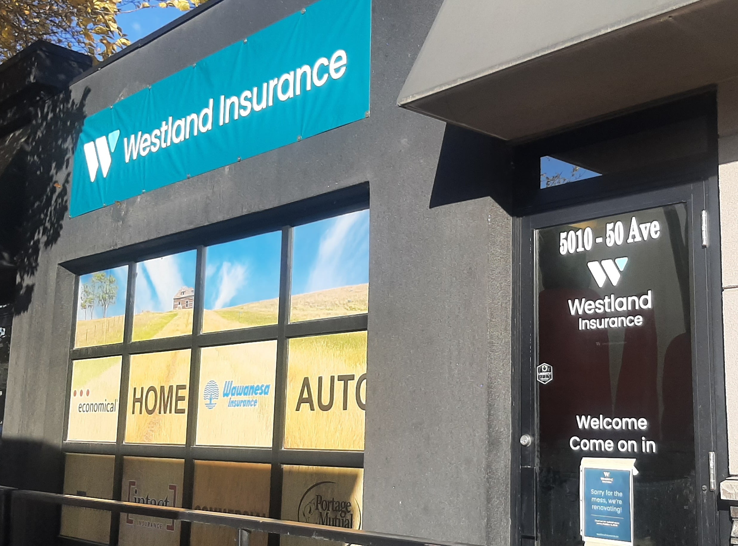 Temporary Vinyl Banner + Final Illuminated Cabinet for Westland Insurance in Leduc, AB