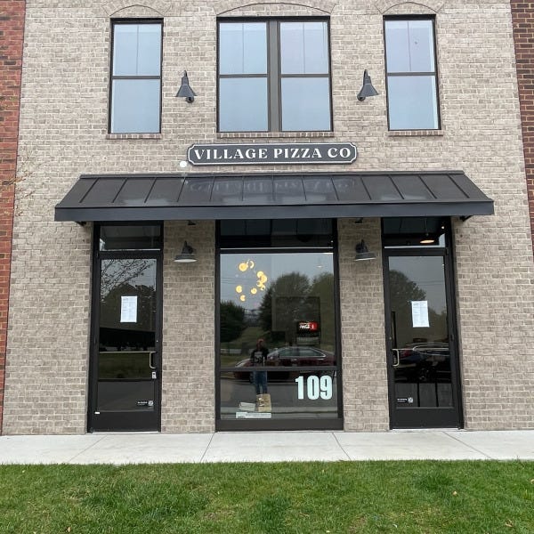 Village Pizza Exterior Sign