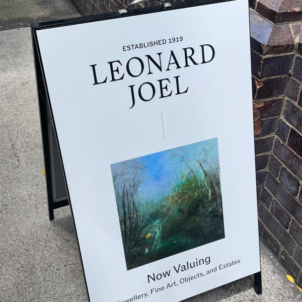 Black a-frame signage with vinyl applied to face by Signarama Brendale for Leonard Joel.