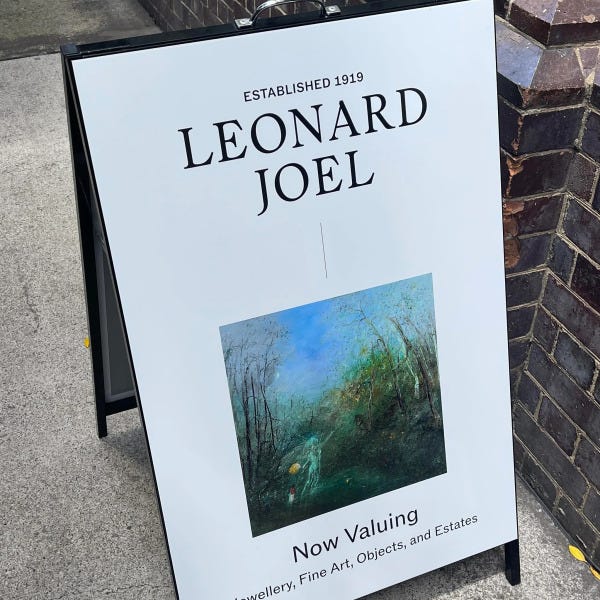 Black a-frame signage with vinyl applied to face by Signarama Brendale for Leonard Joel.
