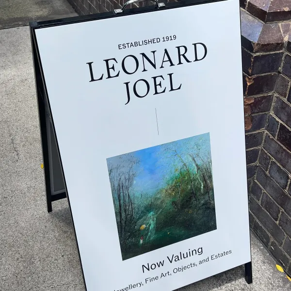 Black a-frame signage with vinyl applied to face by Signarama Brendale for Leonard Joel.