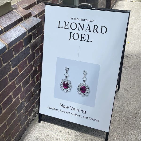 Black metal A-frame with vinyl applied to face signage by Signarama Brendale for Leonard Joel.