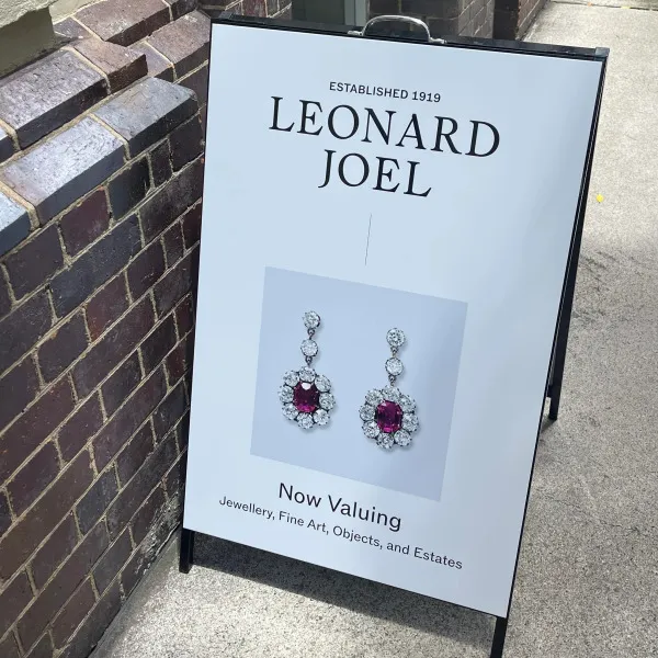 Black metal A-frame with vinyl applied to face signage by Signarama Brendale for Leonard Joel.