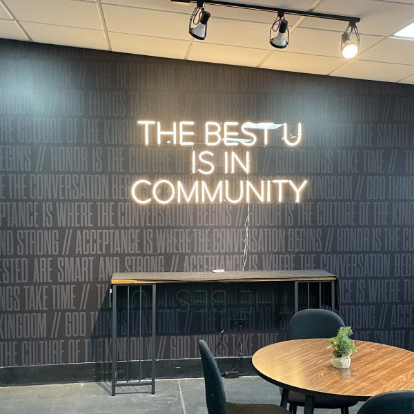 Wall graphics and LED sign for an inviting community space.