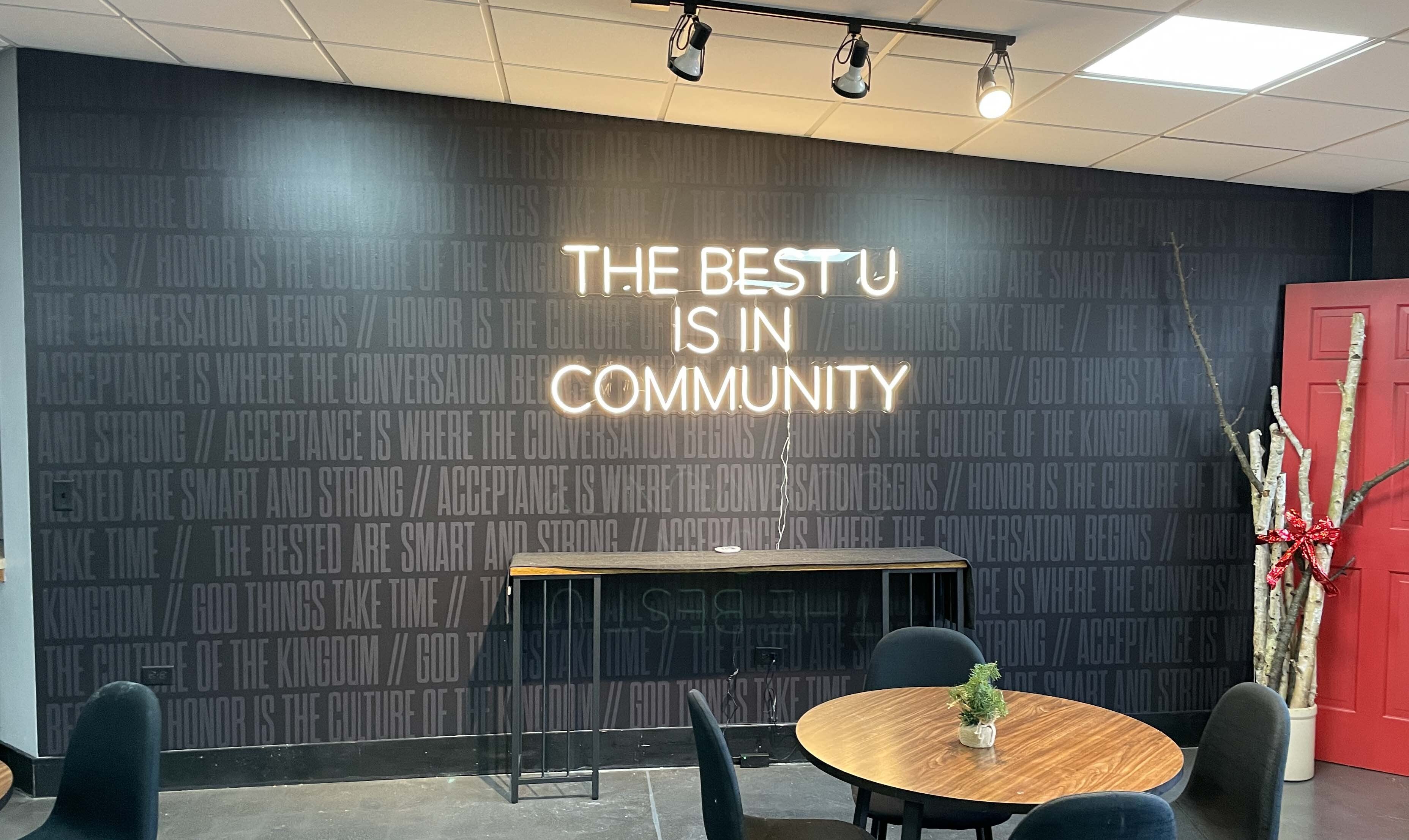 Wall graphics and LED sign for an inviting community space.