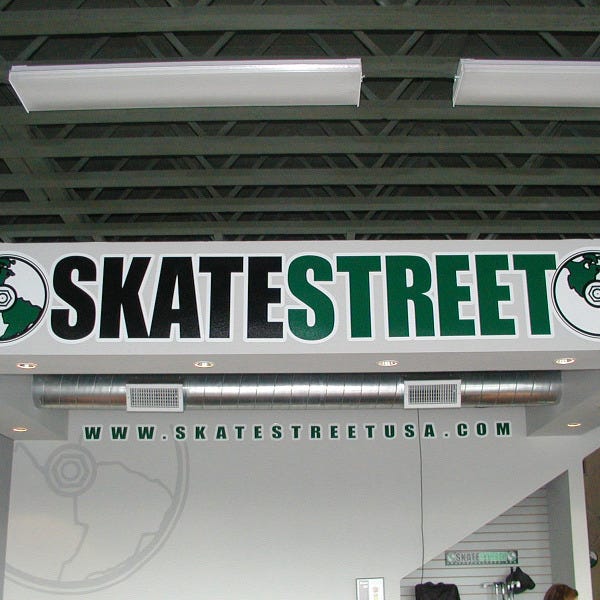 SkateStreet wall vinyl decal featuring vibrant skateboarding design for indoor spaces.