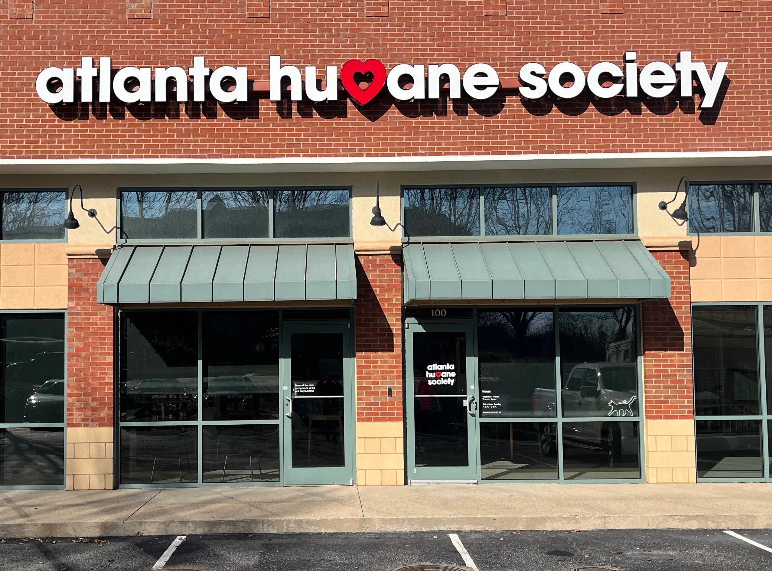 Illuminated channel letter building sign with heart graphic for Atlanta Humane Society, installed by Signarama Roswell
