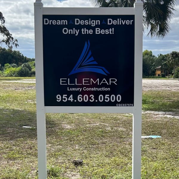 Post N Panel Sign announcing Luxury Construction Company doing work in community.