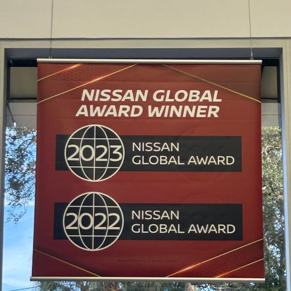 Hanging, double sided banner for auto dealer showroom in Coral Springs, FL