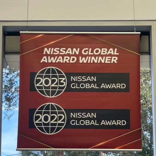 Hanging, double sided banner for auto dealer showroom in Coral Springs, FL
