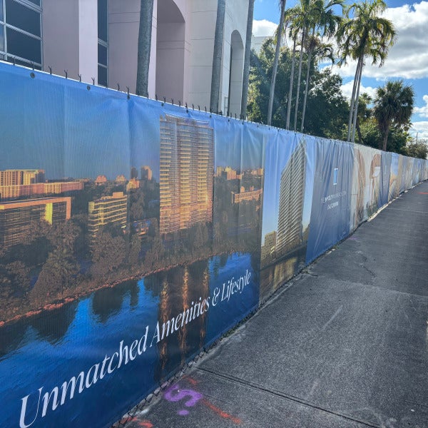 Fence Banners announce luxury condos coming soon to intercoastal waterway in West Palm Beach, FL.